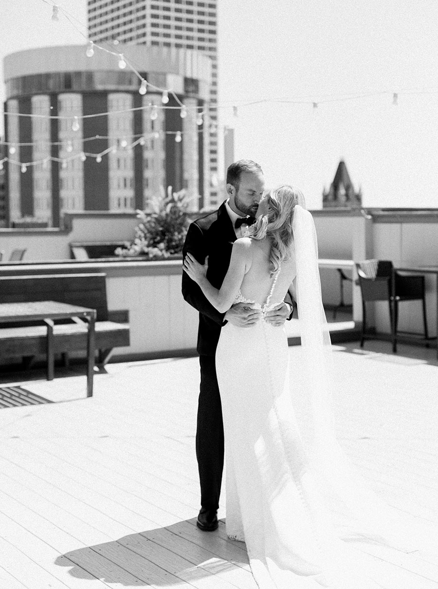 bride and groom first look for milwaukee athletic club elegant classic wedding, blush bridesmaids and belle fiori flowers, romantic summer wedding, photo by laurelyn savannah photography 2
