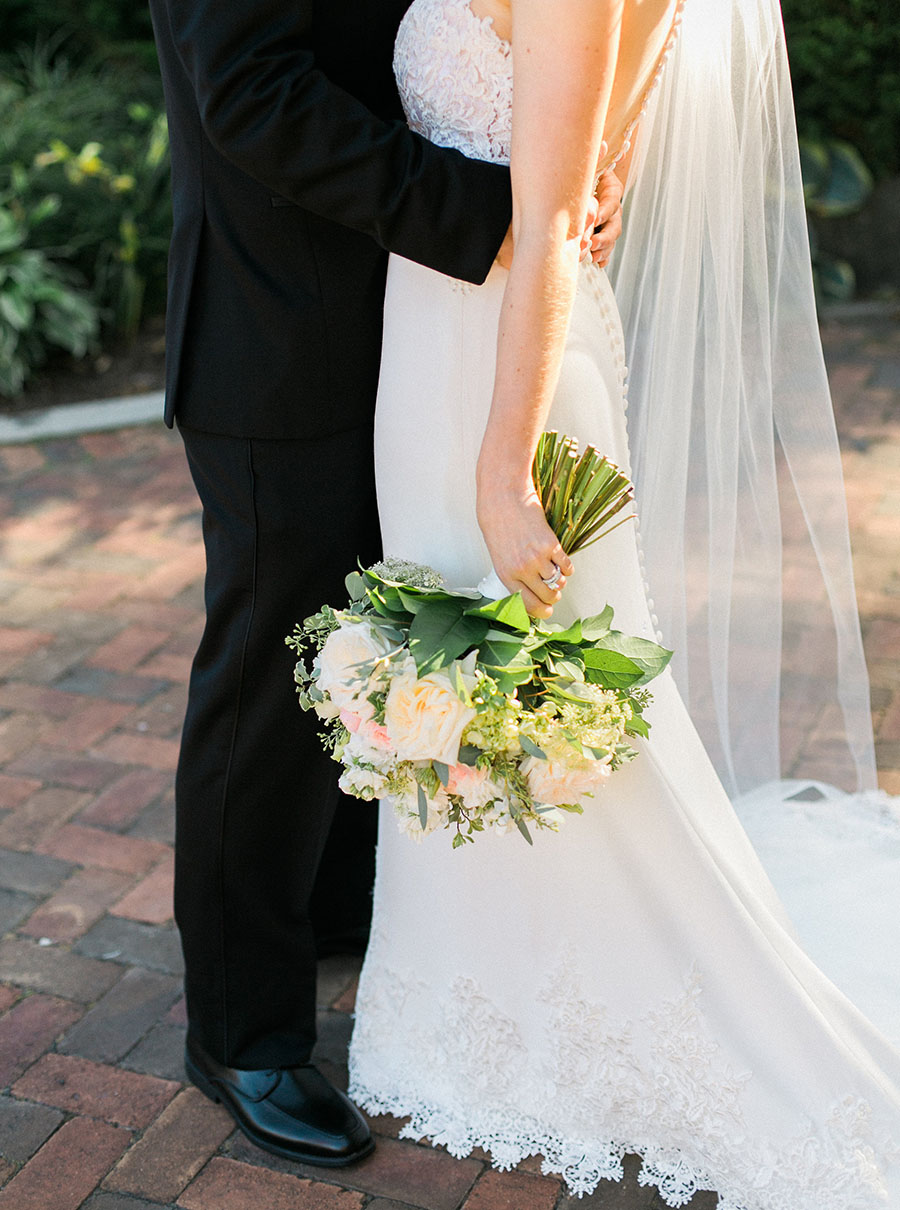 bride and groom at lake park and milwaukee athletic club elegant classic wedding, blush bridesmaids and belle fiori flowers, romantic summer wedding, photo by laurelyn savannah photography 12