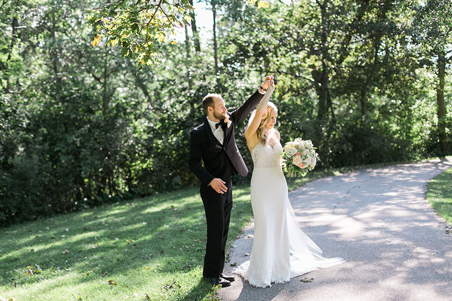 bride and groom at lake park and milwaukee athletic club elegant classic wedding, blush bridesmaids and belle fiori flowers, romantic summer wedding, photo by laurelyn savannah photography 16