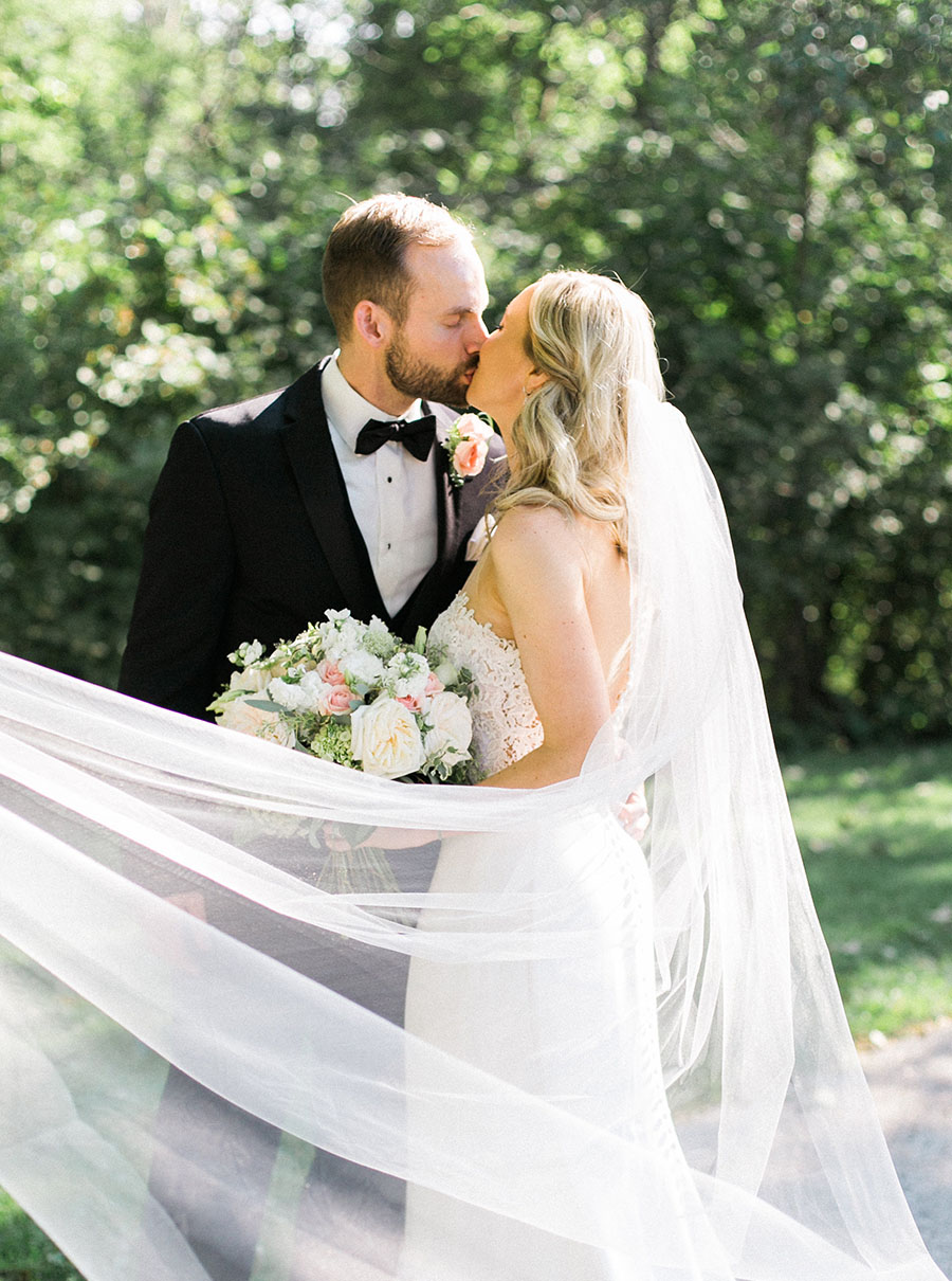 bride and groom at lake park and milwaukee athletic club elegant classic wedding, blush bridesmaids and belle fiori flowers, romantic summer wedding, photo by laurelyn savannah photography 17
