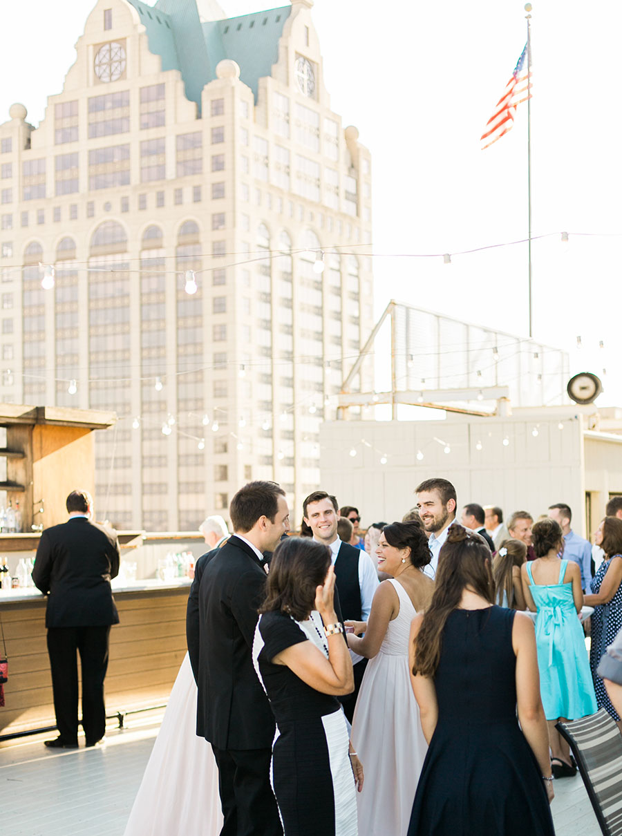 rooftop cocktail hour at milwaukee athletic club elegant classic wedding, blush bridesmaids and belle fiori flowers, romantic summer wedding, photo by laurelyn savannah photography