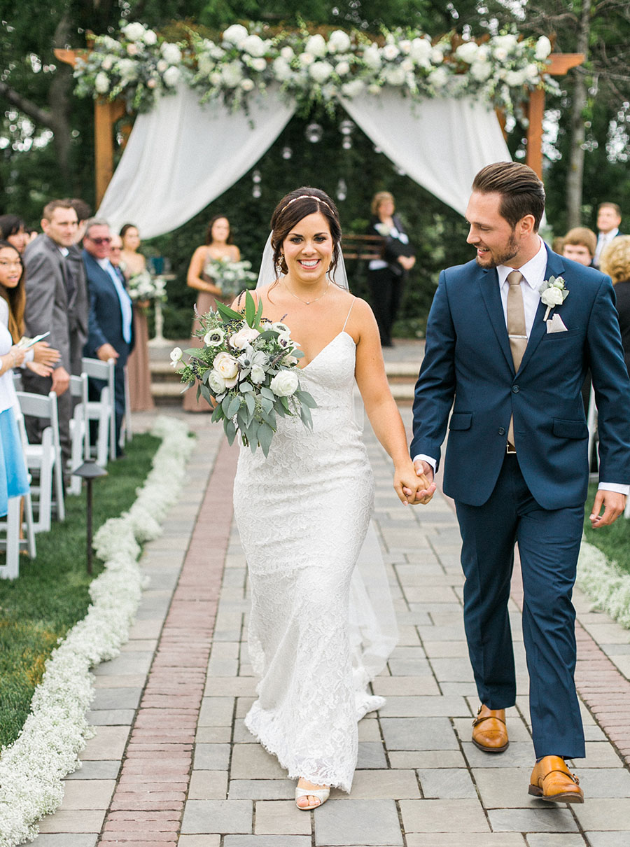 ceremony exit, romantic and organic wedding at the ridge hotel in lake geneva, wisconsin, with elegant neutral colors, photo by laurelyn savannah photography 37
