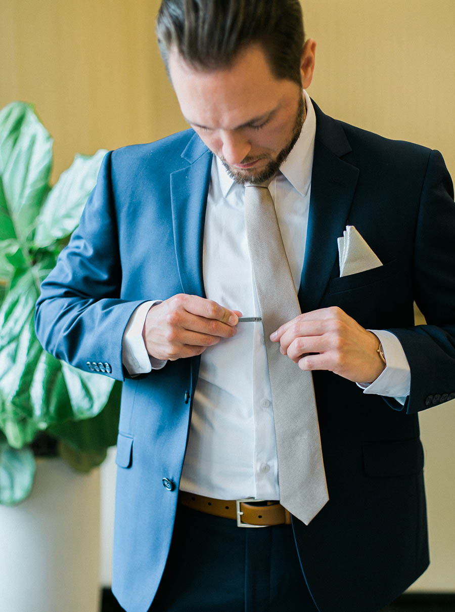 groom getting ready, romantic and organic wedding at the ridge hotel in lake geneva, wisconsin, with elegant neutral colors, photo by laurelyn savannah photography 7