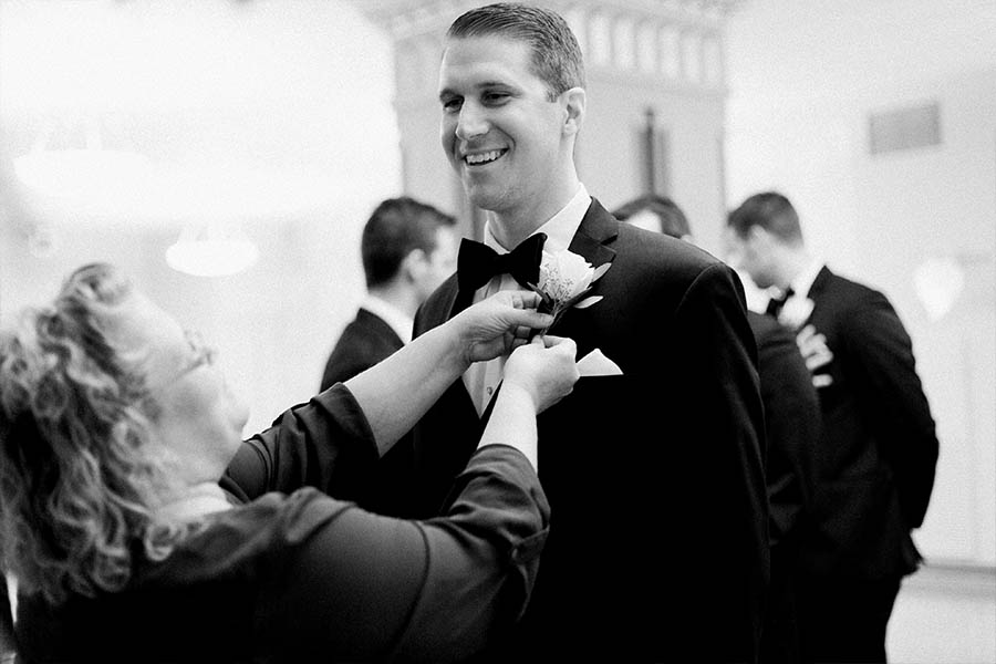 groom getting ready, romantic and modern wedding at the basilica of st josaphat and milwaukee county historical society, wisconsin, elegant neutral white ivory colors, photo by laurelyn savannah photography 12