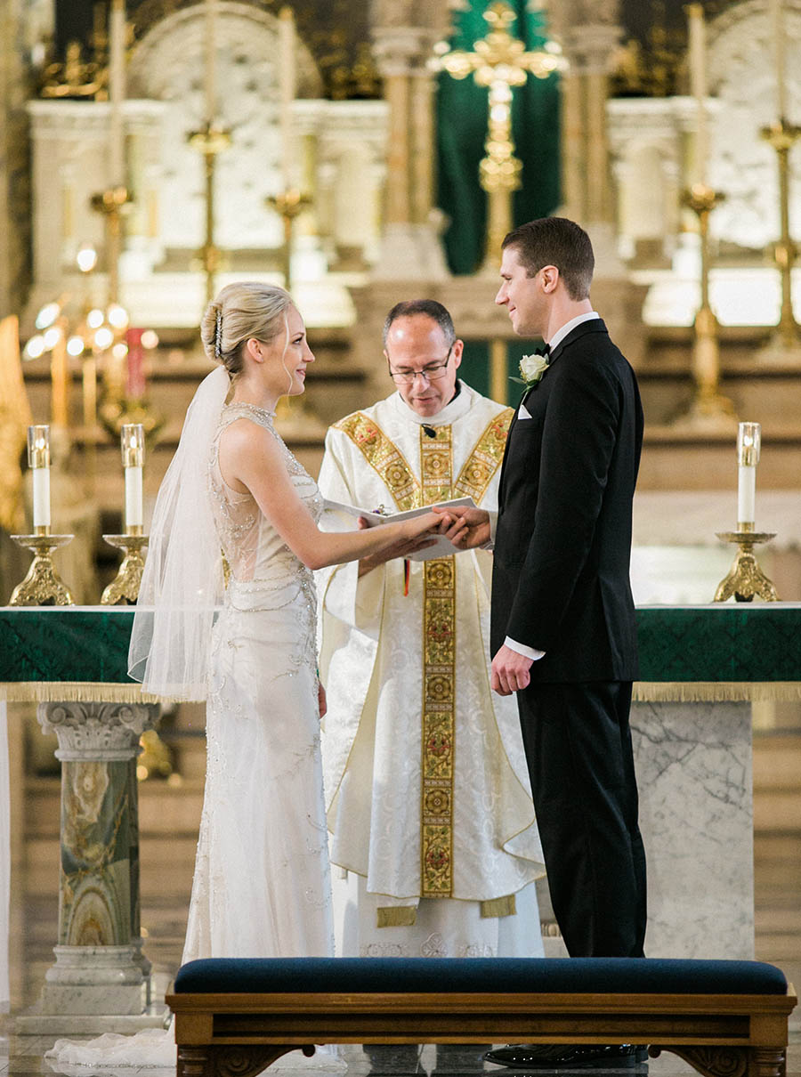 ceremony vow exchange, romantic and modern wedding at the basilica of st josaphat and milwaukee county historical society, wisconsin, elegant neutral white ivory colors, photo by laurelyn savannah photography 19