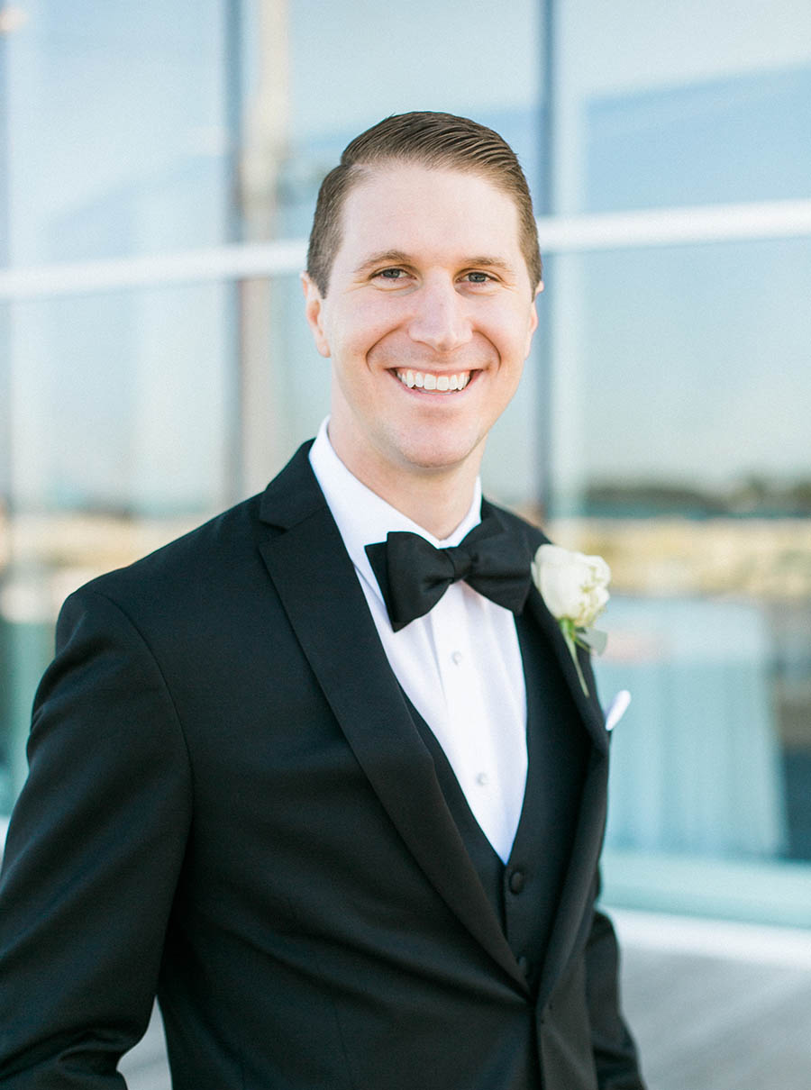 groom photos lakefront discovery world, romantic and modern wedding at the basilica of st josaphat and milwaukee county historical society, wisconsin, elegant neutral white ivory colors, photo by laurelyn savannah photography 30