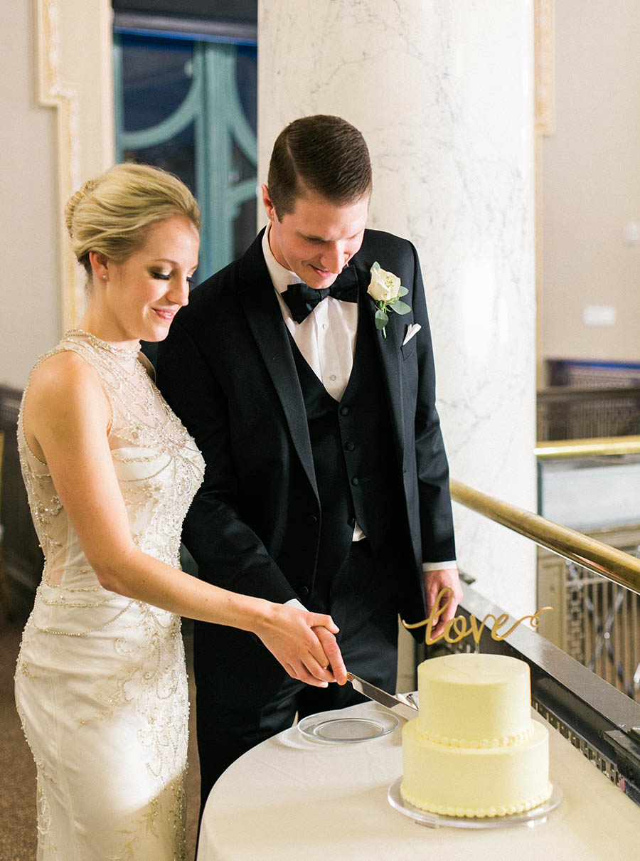 cake cutting, romantic and modern wedding at the basilica of st josaphat and milwaukee county historical society, wisconsin, elegant neutral white ivory colors, photo by laurelyn savannah photography 44