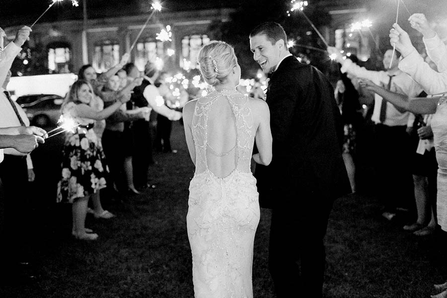 sparkler exit bride and groom portrait, romantic and modern wedding at the basilica of st josaphat and milwaukee county historical society, wisconsin, elegant neutral white ivory colors, photo by laurelyn savannah photography 47
