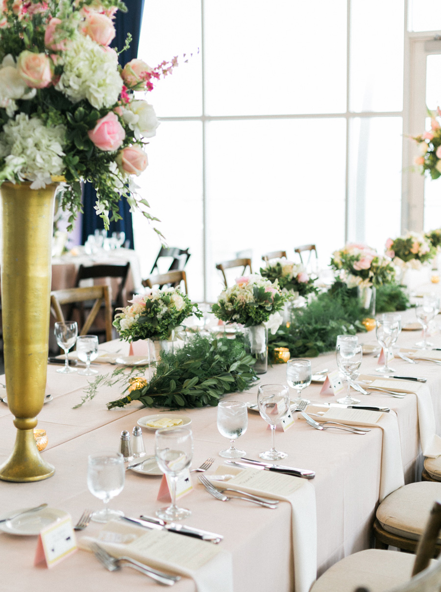blush pink reception tables and wooden x-back chairs, discovery world summer lakeside elegant romantic wedding in milwaukee, wisconsin, photo by laurelyn savannah photography 35
