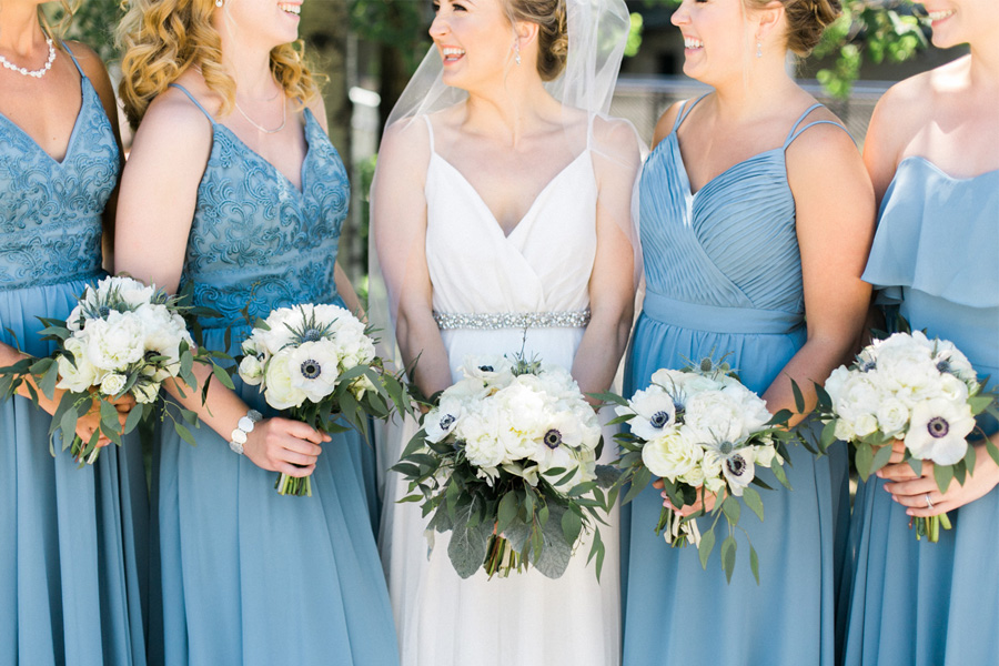 bride and bridesmaids, Blue Watercolor-Inspired, elegant downtown modern wedding along the Milwaukee River in Wisconsin, photo by Laurelyn Savannah Photography 8