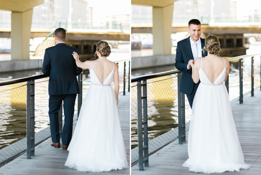 first look bride and groom, Blue Watercolor-Inspired, elegant downtown modern wedding along the Milwaukee River in Wisconsin, photo by Laurelyn Savannah Photography 13
