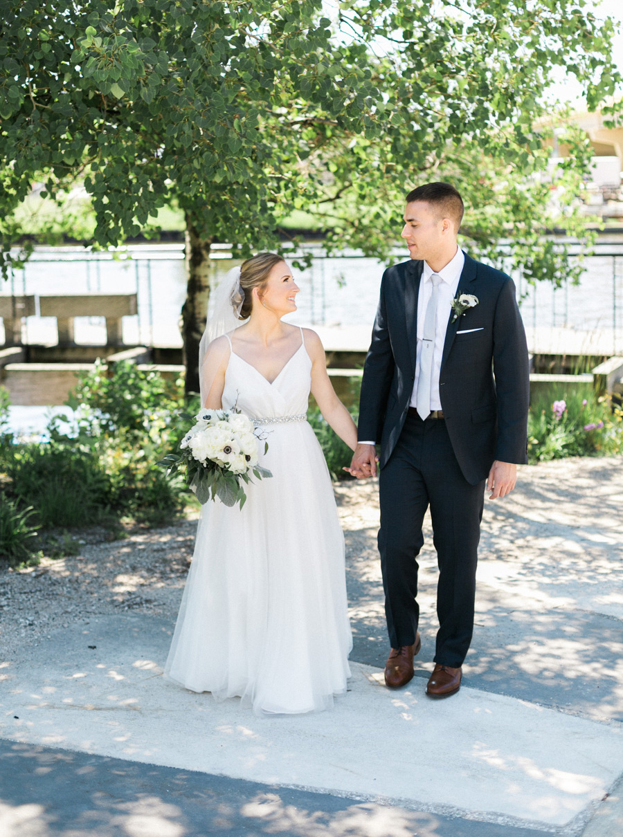 bride and groom, Blue Watercolor-Inspired, elegant downtown modern wedding along the Milwaukee River in Wisconsin, photo by Laurelyn Savannah Photography 18