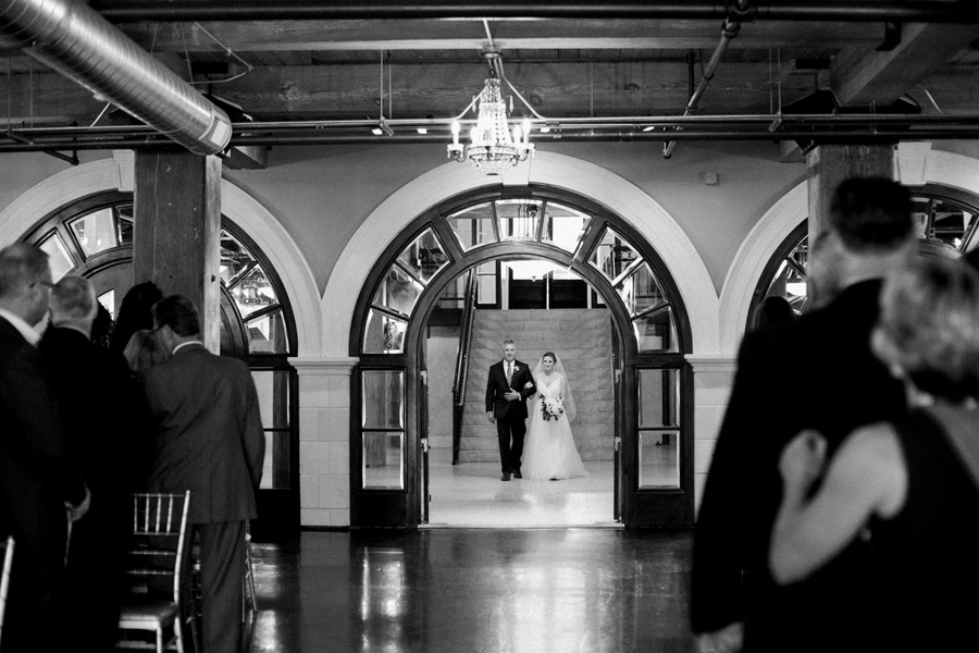 bride entering ceremony, Blue Watercolor-Inspired, elegant downtown modern wedding along the Milwaukee River in Wisconsin, photo by Laurelyn Savannah Photography 20