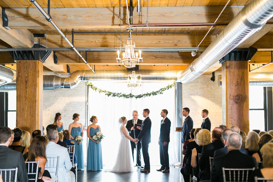 ceremony, Blue Watercolor-Inspired, elegant downtown modern wedding along the Milwaukee River in Wisconsin, photo by Laurelyn Savannah Photography 22
