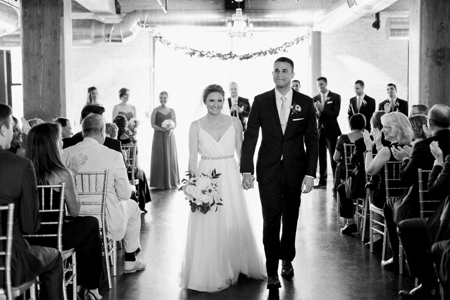 ceremony exit, Blue Watercolor-Inspired, elegant downtown modern wedding along the Milwaukee River in Wisconsin, photo by Laurelyn Savannah Photography 26