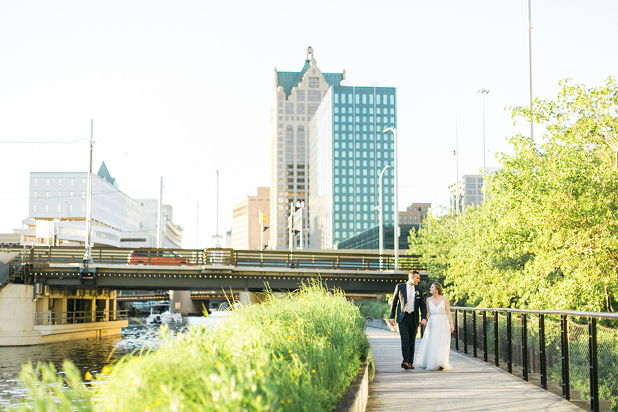 bride and groom sunset portrait, Blue Watercolor-Inspired, elegant downtown modern wedding along the Milwaukee River in Wisconsin, photo by Laurelyn Savannah Photography 50