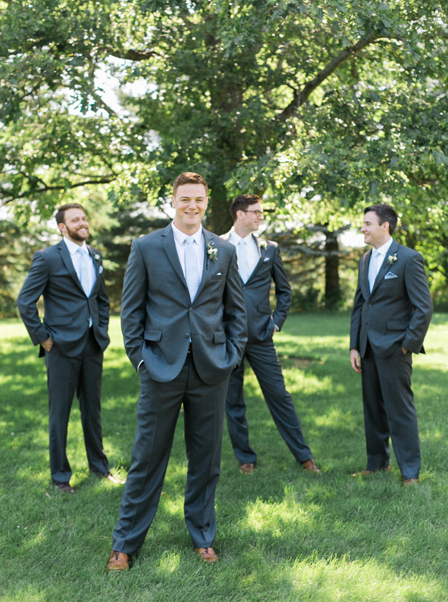 groom and groomsmen, outdoor tented private estate wedding in a field in wisconsin, gold and blue colors, photo by laurelyn savannah photography 8