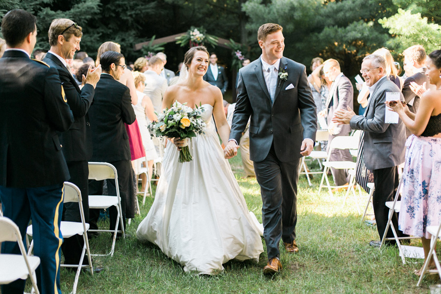 ceremony exit, outdoor tented private estate wedding in a field in wisconsin, gold and blue colors, photo by laurelyn savannah photography 25