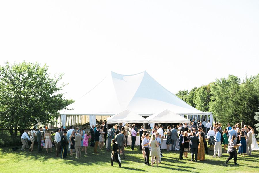 cocktail hour, outdoor tented private estate wedding in a field in wisconsin, gold and blue colors, photo by laurelyn savannah photography 27