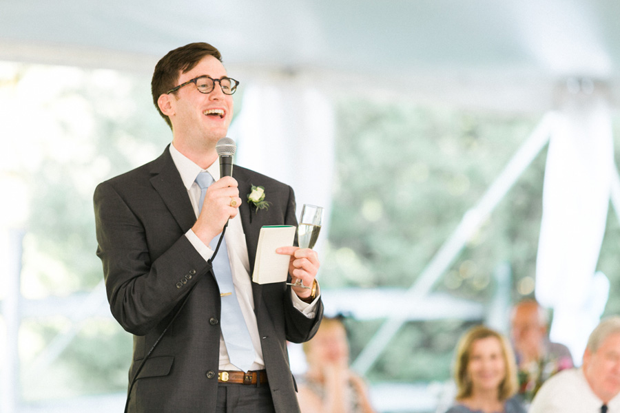 speech and toast, outdoor tented private estate wedding in a field in wisconsin, gold and blue colors, photo by laurelyn savannah photography 35
