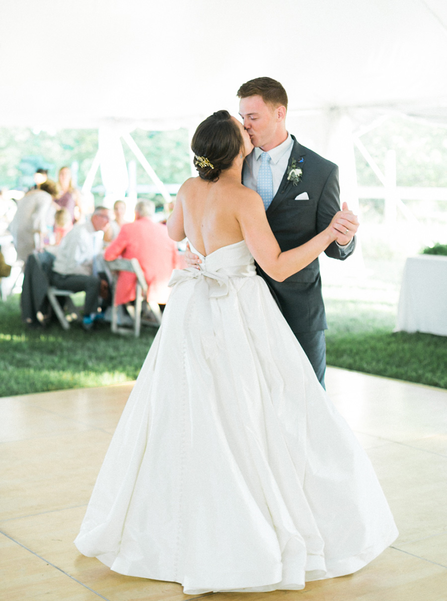 bride and groom first dance, outdoor tented private estate wedding in a field in wisconsin, gold and blue colors, photo by laurelyn savannah photography 37