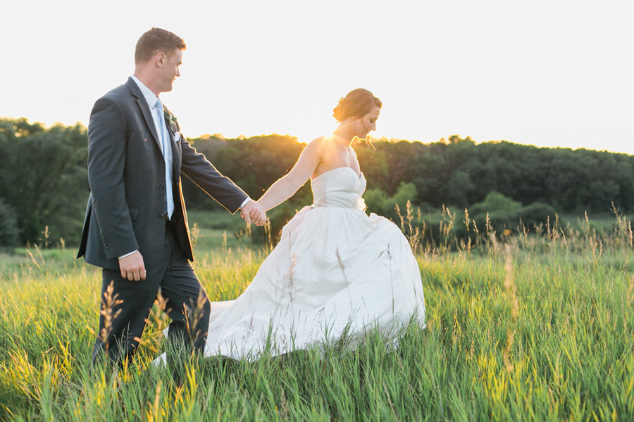 bride and groom sunset portraits, outdoor tented private estate wedding in a field in wisconsin, gold and blue colors, photo by laurelyn savannah photography 45