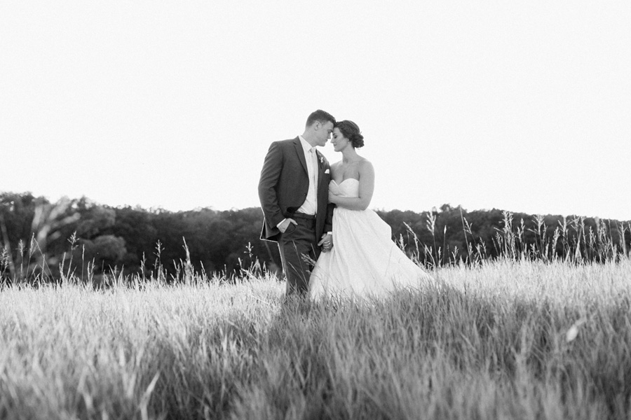 bride and groom sunset portraits, outdoor tented private estate wedding in a field in wisconsin, gold and blue colors, photo by laurelyn savannah photography 47