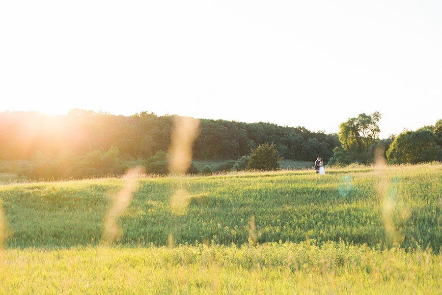 bride and groom sunset portraits, outdoor tented private estate wedding in a field in wisconsin, gold and blue colors, photo by laurelyn savannah photography 48