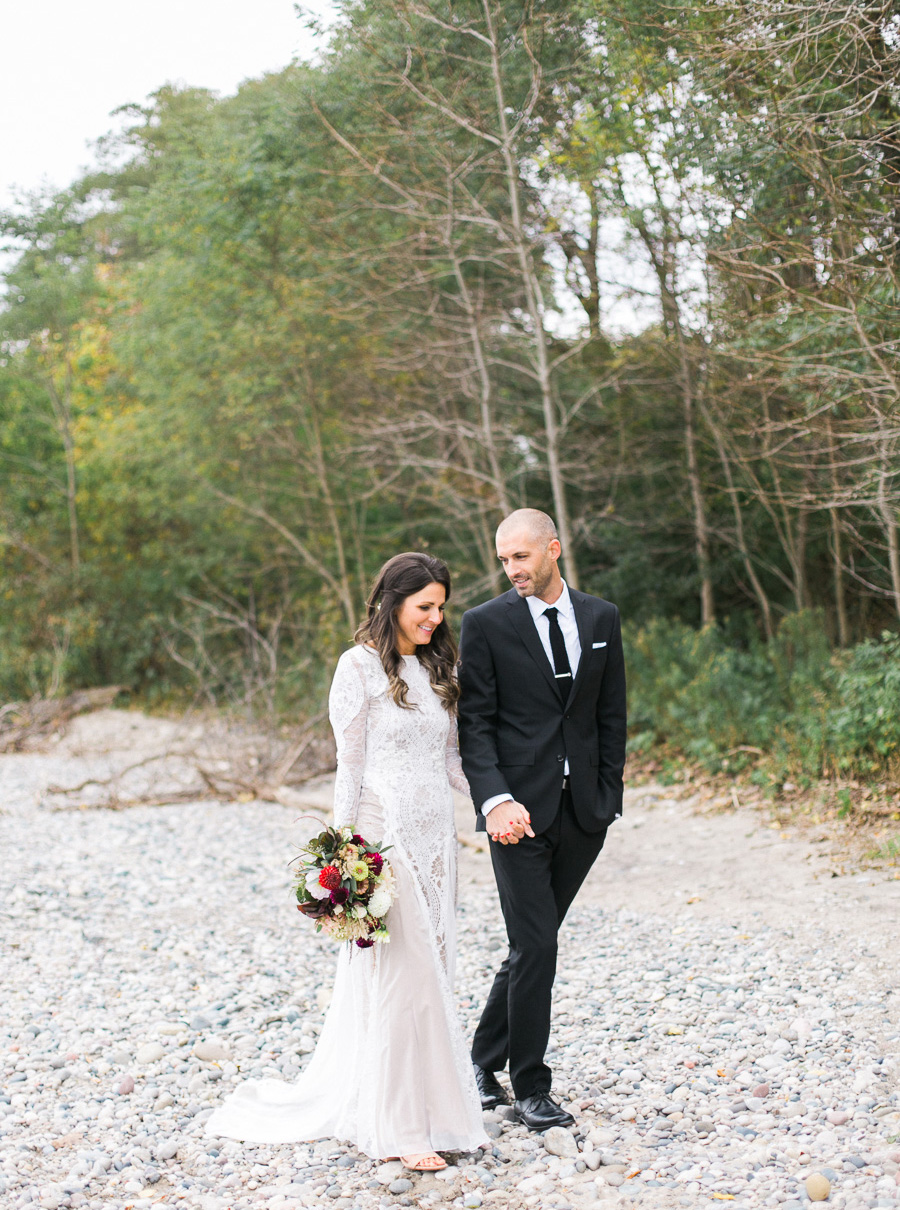 bride and groom portrait at a boho outdoor wedding at Schlitz Audubon Nature Center in Milwaukee, Wisconsin, photo by Laurelyn Savannah Photography 21