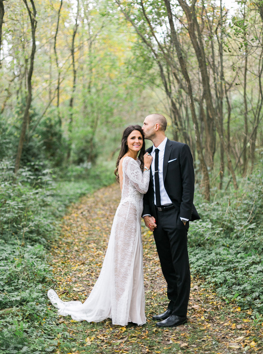 bride and groom portrait at a boho outdoor wedding at Schlitz Audubon Nature Center in Milwaukee, Wisconsin, photo by Laurelyn Savannah Photography 31