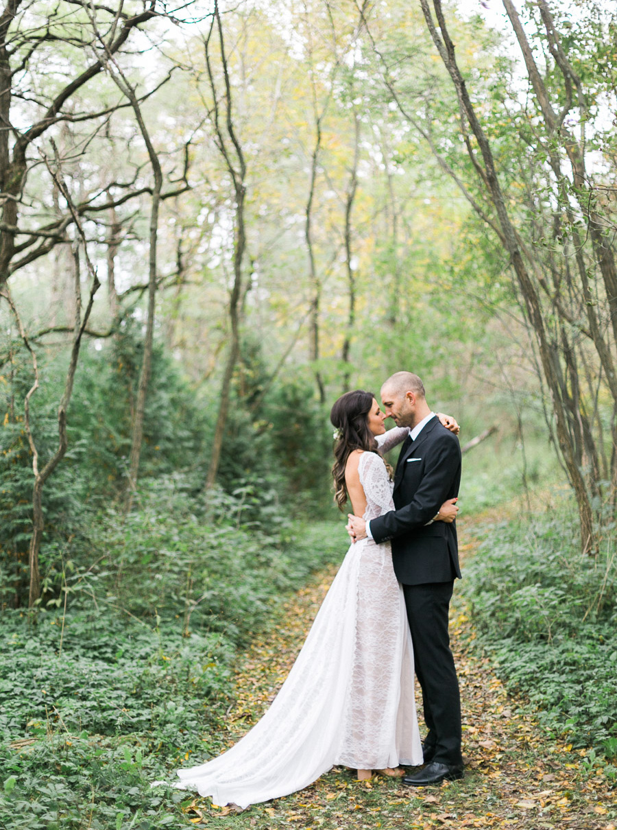 bride and groom portrait at a boho outdoor wedding at Schlitz Audubon Nature Center in Milwaukee, Wisconsin, photo by Laurelyn Savannah Photography 40