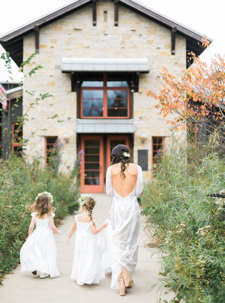 bride and flower girls portrait at a boho outdoor wedding at Schlitz Audubon Nature Center in Milwaukee, Wisconsin, photo by Laurelyn Savannah Photography 41