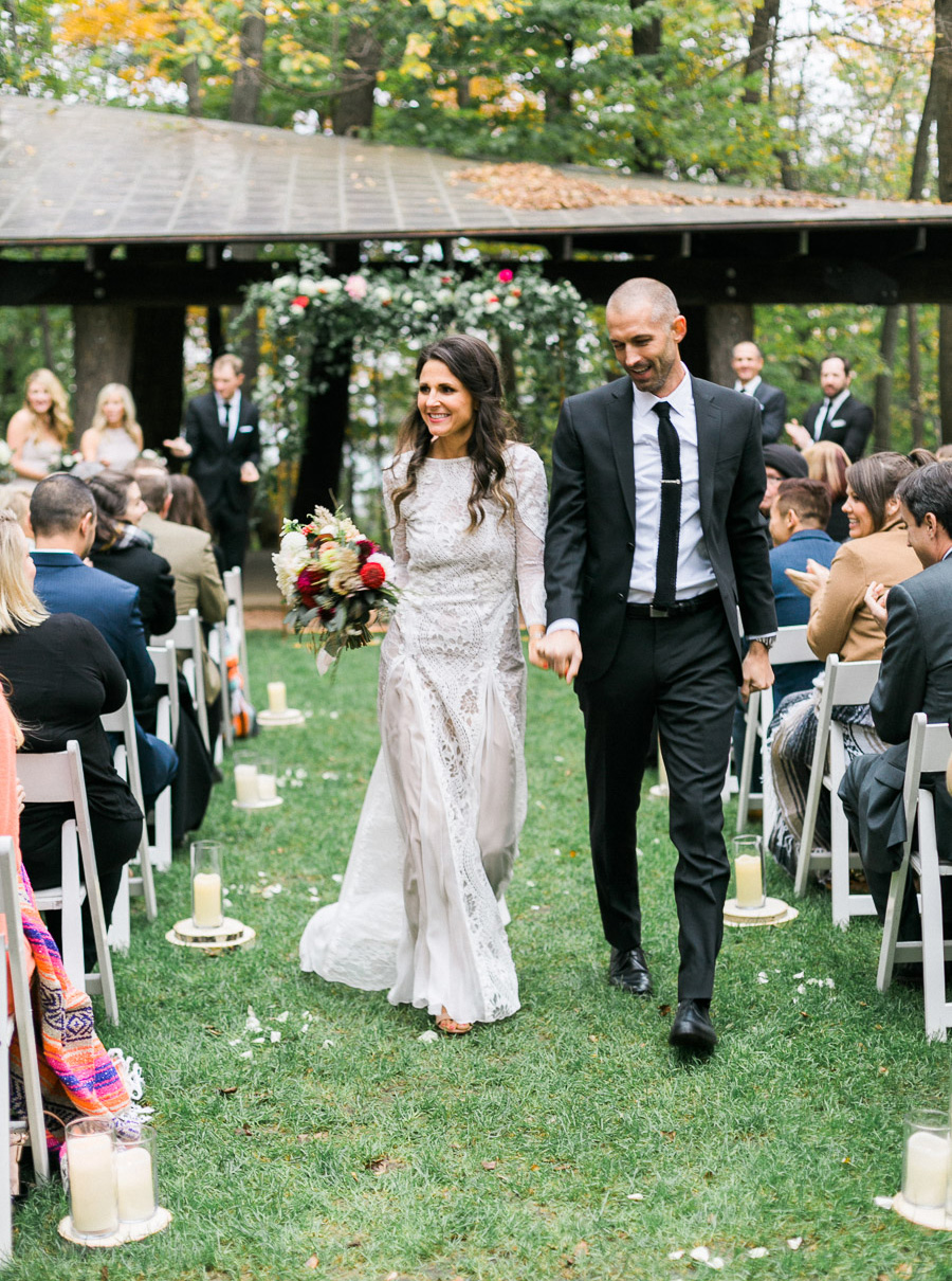 ceremony exit at a boho outdoor wedding at Schlitz Audubon Nature Center in Milwaukee, Wisconsin, photo by Laurelyn Savannah Photography 55