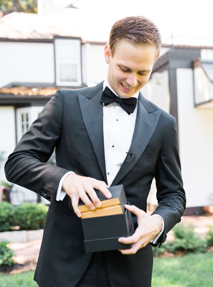 groom getting ready, classic and romantic gold wedding in downtown Green Bay, Wisconsin, photo by Laurelyn Savannah Photography