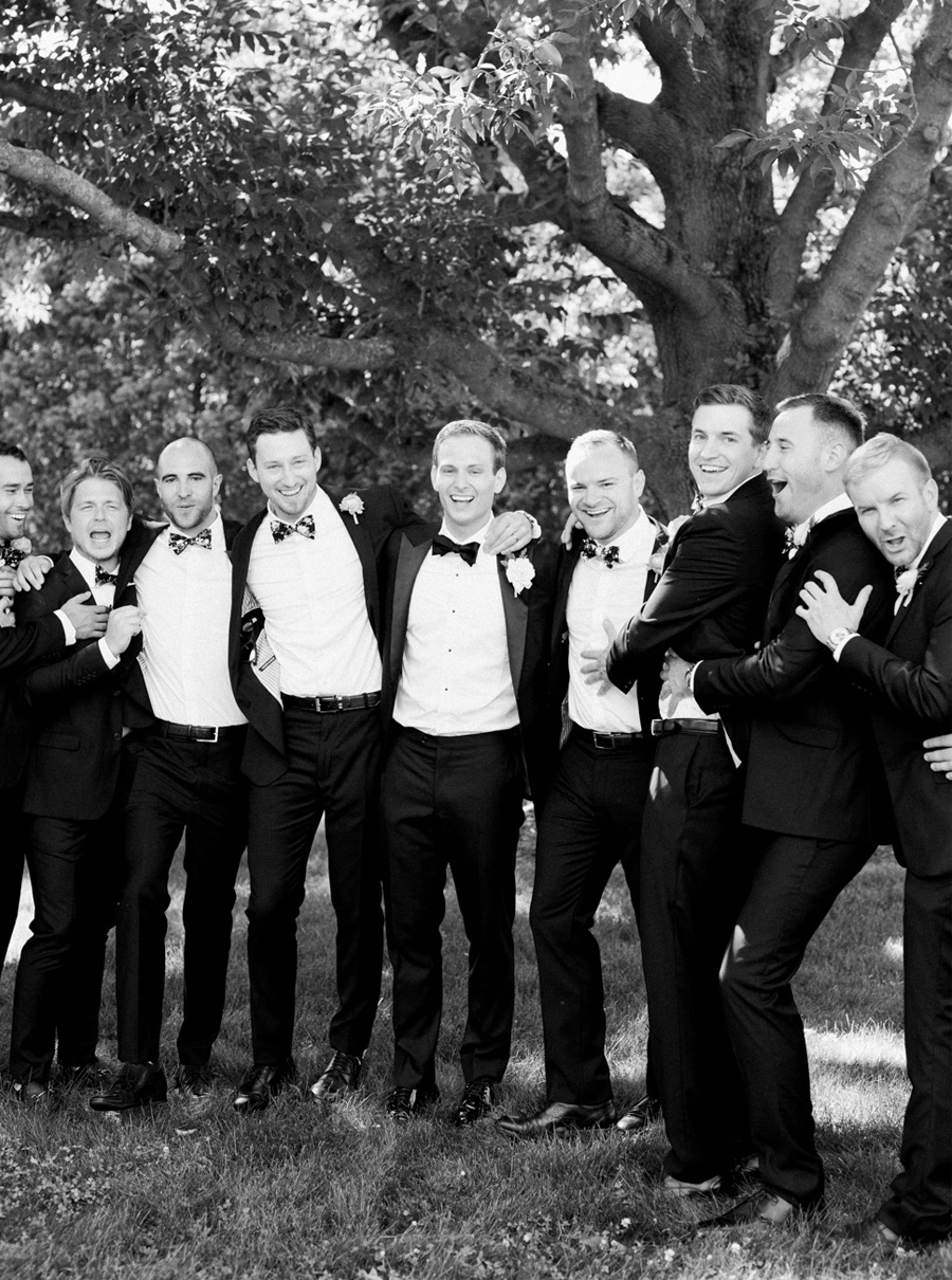 groom and groomsmen, classic and romantic gold wedding in downtown Green Bay, Wisconsin, photo by Laurelyn Savannah Photography