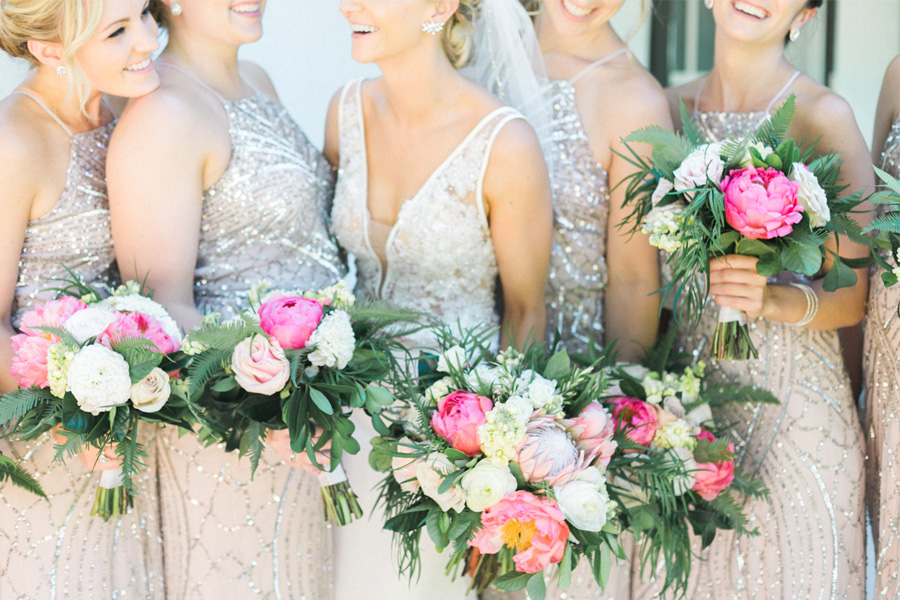 bride and bridesmaids, classic and romantic gold wedding in downtown Green Bay, Wisconsin, photo by Laurelyn Savannah Photography