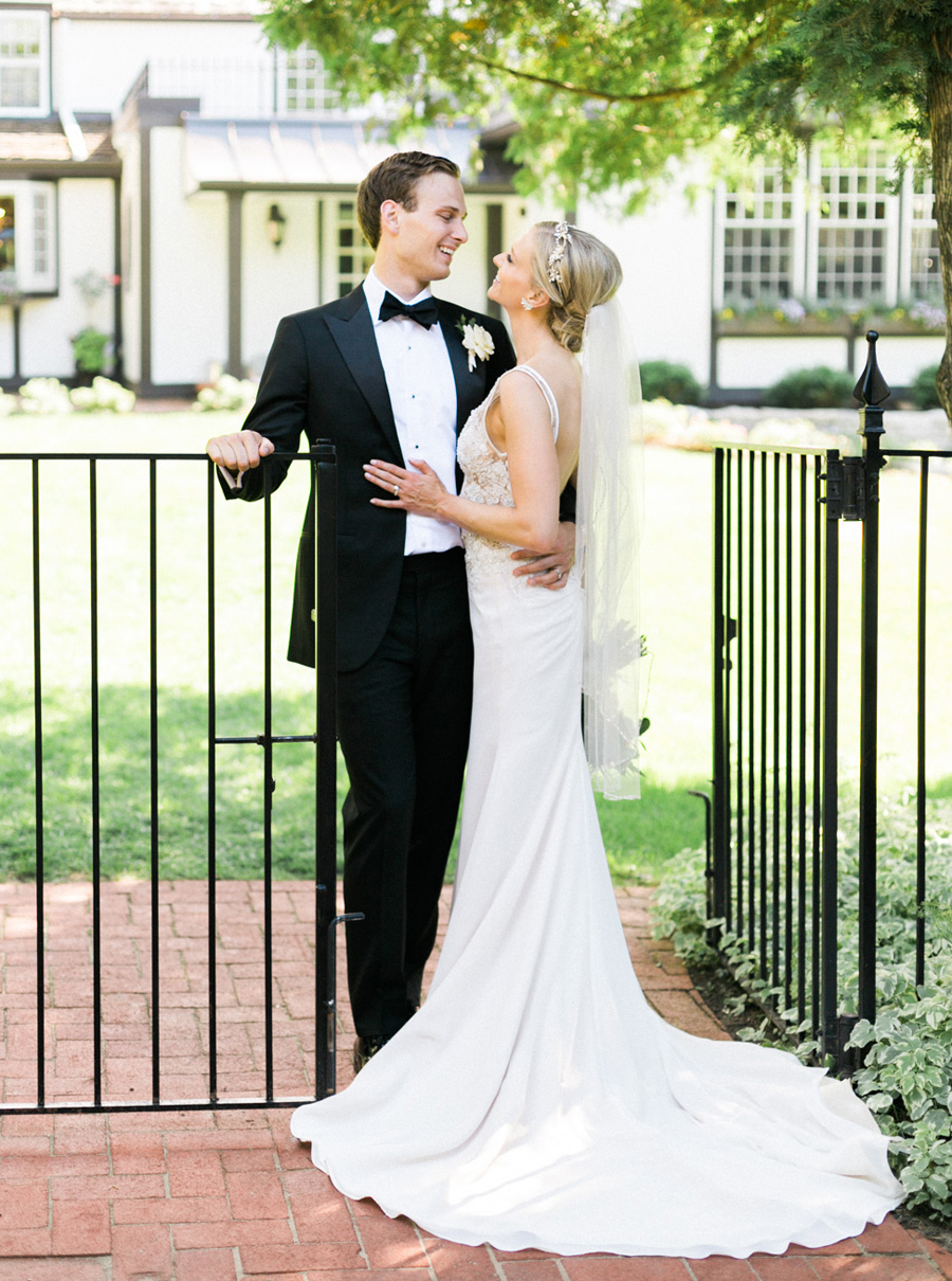 bride and groom portraits, classic and romantic black tie and gold wedding in downtown Green Bay, Wisconsin, photo by Laurelyn Savannah Photography