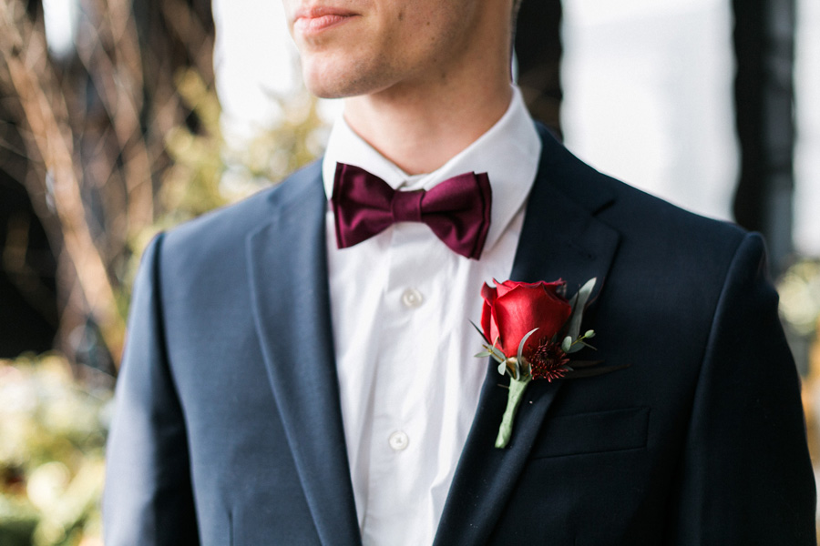 groom getting ready, classic, romantic gold and burgundy red winter wedding in downtown Milwaukee, Wisconsin, photo by Laurelyn Savannah Photography