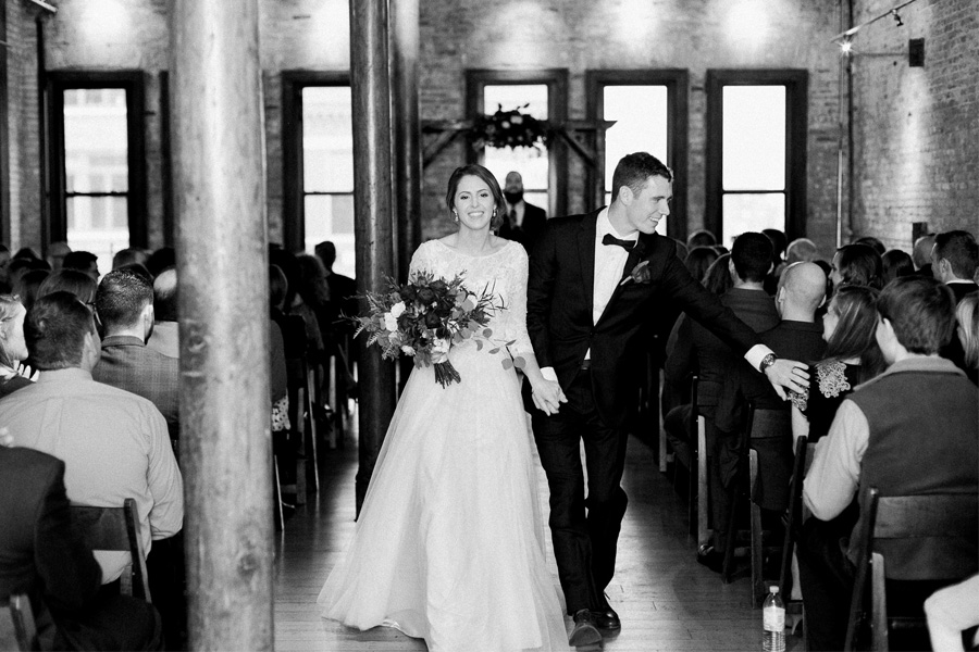 ceremony, classic, romantic gold and burgundy red winter wedding at cuvee in downtown Milwaukee, Wisconsin, photo by Laurelyn Savannah Photography