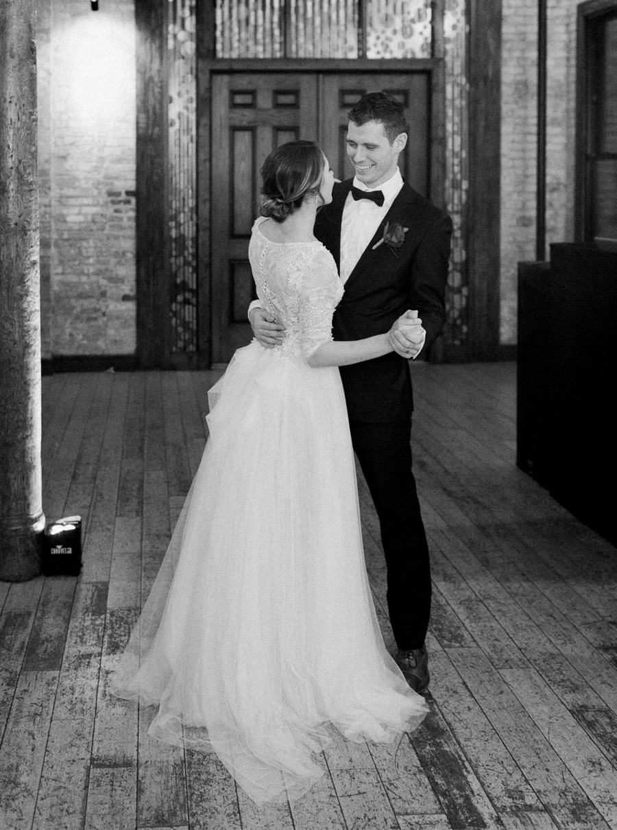 reception dance, classic, romantic gold and burgundy red winter wedding at cuvee in downtown Milwaukee, Wisconsin, photo by Laurelyn Savannah Photography