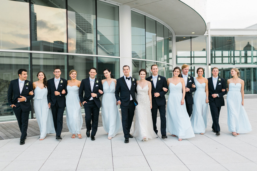 bridal party portrait at Discovery World new pavilion, elegant and modern lakefront wedding in downtown Milwaukee, Wisconsin with NYC flair, photo by Laurelyn Savannah Photography