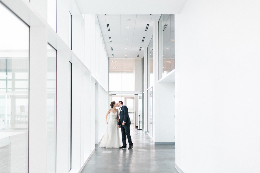 bride and groom grand entrance at Discovery World, elegant and modern lakefront wedding in downtown Milwaukee, Wisconsin with NYC flair, photo by Laurelyn Savannah Photography