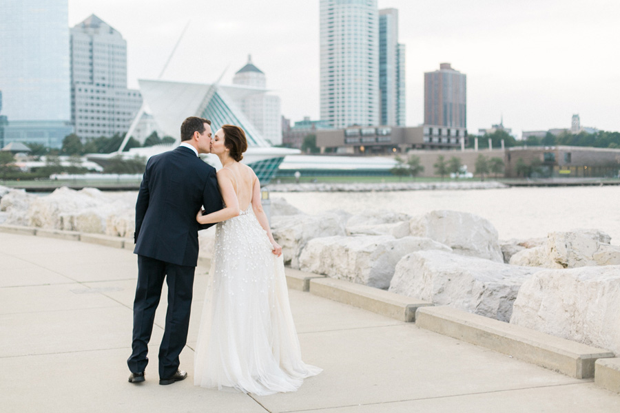 bride and groom portraits at Discovery World new pavilion, elegant and modern lakefront wedding in downtown Milwaukee, Wisconsin with NYC flair, photo by Laurelyn Savannah Photography