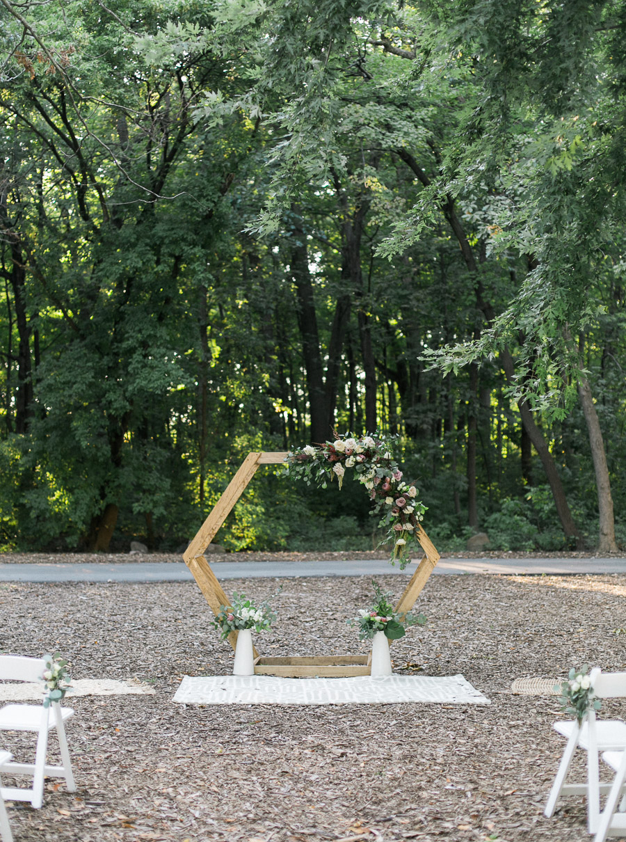 ceremony decor and rugs, glamping and chic safari romantic outdoor wedding at Milwaukee County Zoo, Wisconsin, photo by Laurelyn Savannah Photography