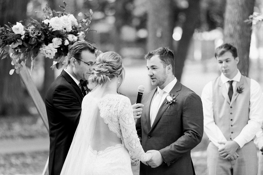 ceremony vows, glamping and chic safari romantic outdoor wedding at Milwaukee County Zoo, Wisconsin, photo by Laurelyn Savannah Photography