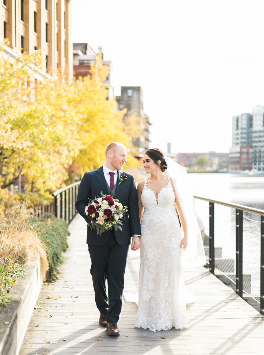 bride and groom portrait, romantic navy and gold and burgundy red fall wedding at Discovery World in downtown Milwaukee, Wisconsin, photo by Laurelyn Savannah Photography