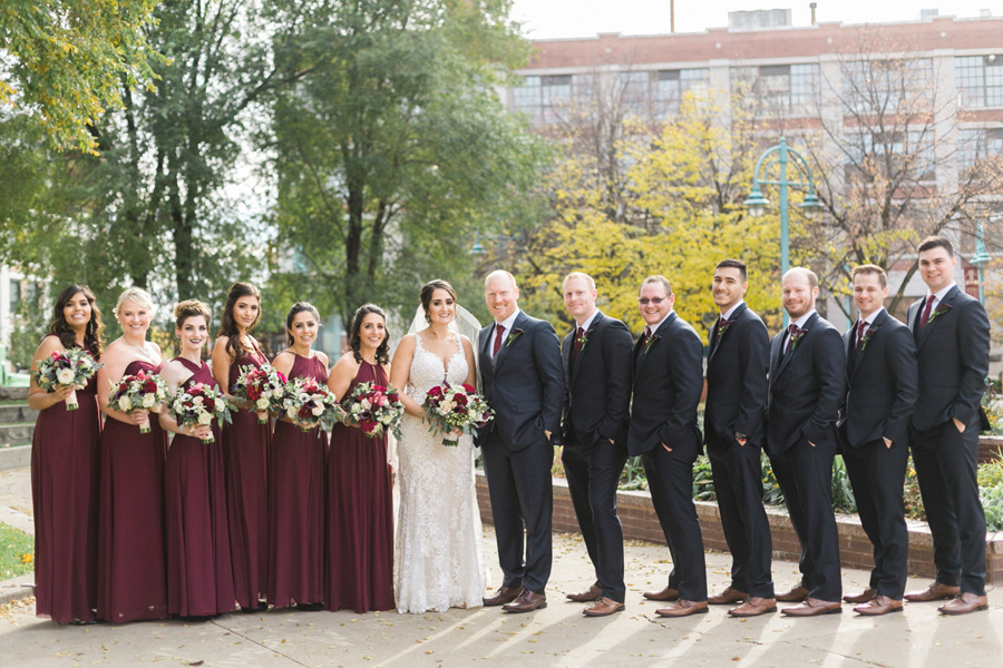bridal party portrait, romantic navy and gold and burgundy red fall wedding at Discovery World in downtown Milwaukee, Wisconsin, photo by Laurelyn Savannah Photography