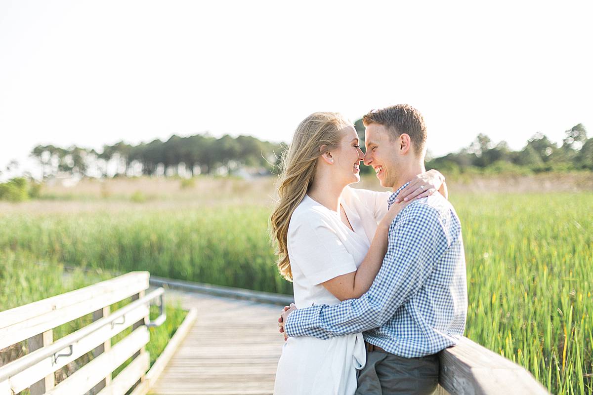bodie island lighthouse, outer banks, north carolina beachfront destination and romantic elegant engagement session photos with a long dress, photo by laurelyn savannah photography