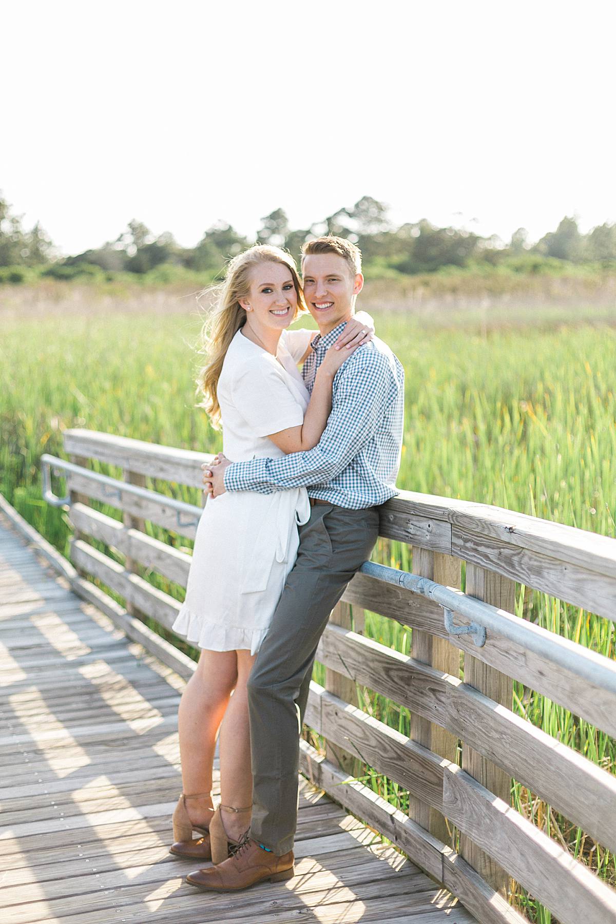 bodie island lighthouse, outer banks, north carolina beachfront destination and romantic elegant engagement session photos with a long dress, photo by laurelyn savannah photography