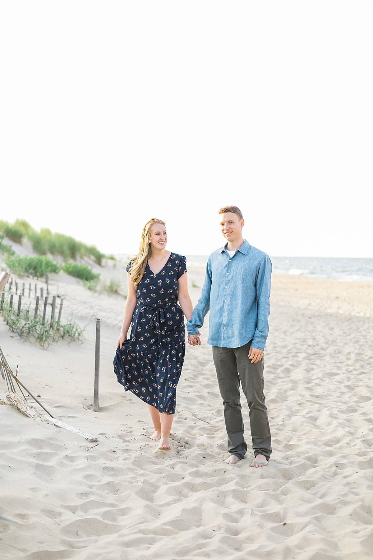 jennette's pier kill devil hills, outer banks, north carolina beachfront destination and romantic elegant engagement session photos with a long dress, photo by laurelyn savannah photography